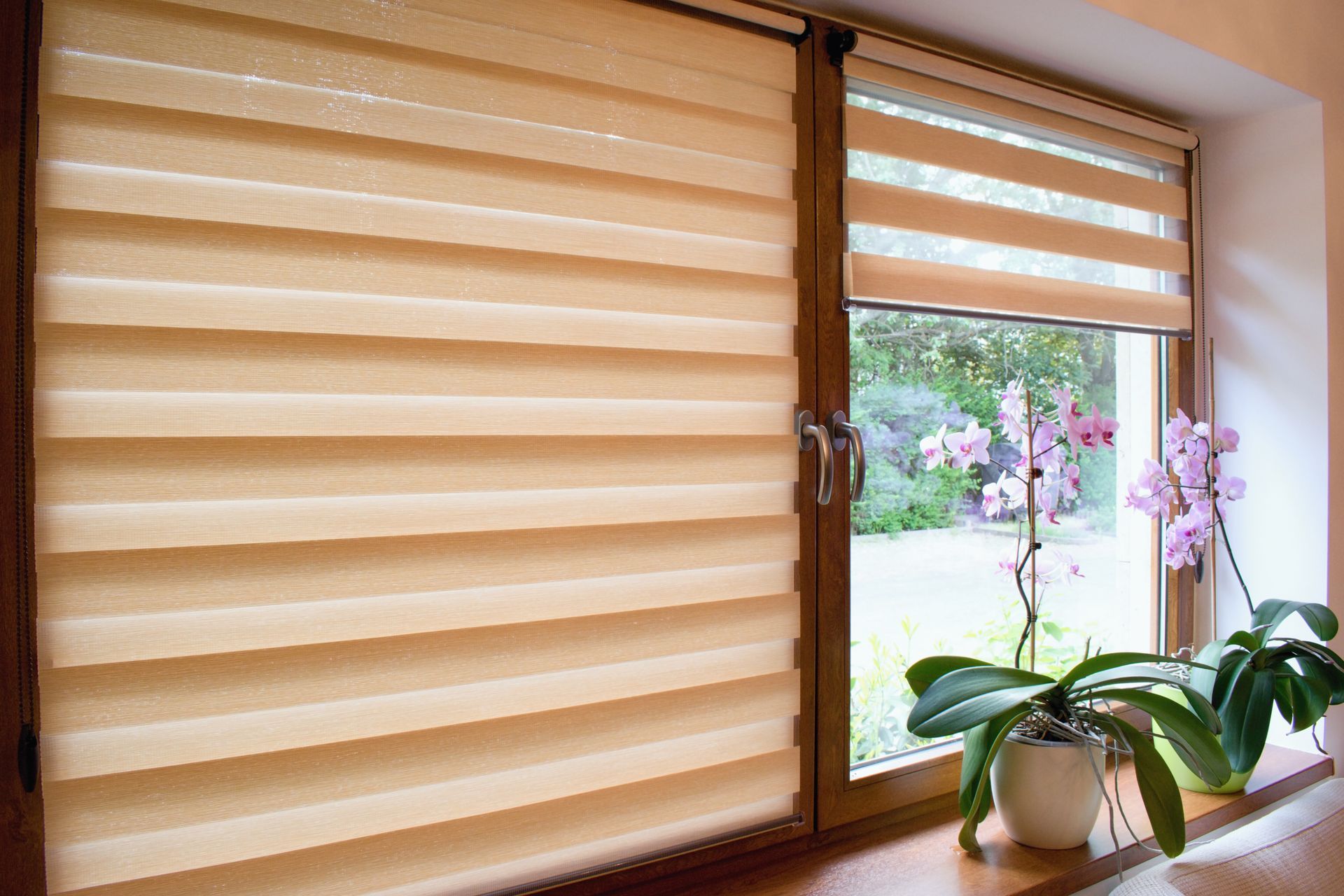 Custom window shades covering two living room windows.