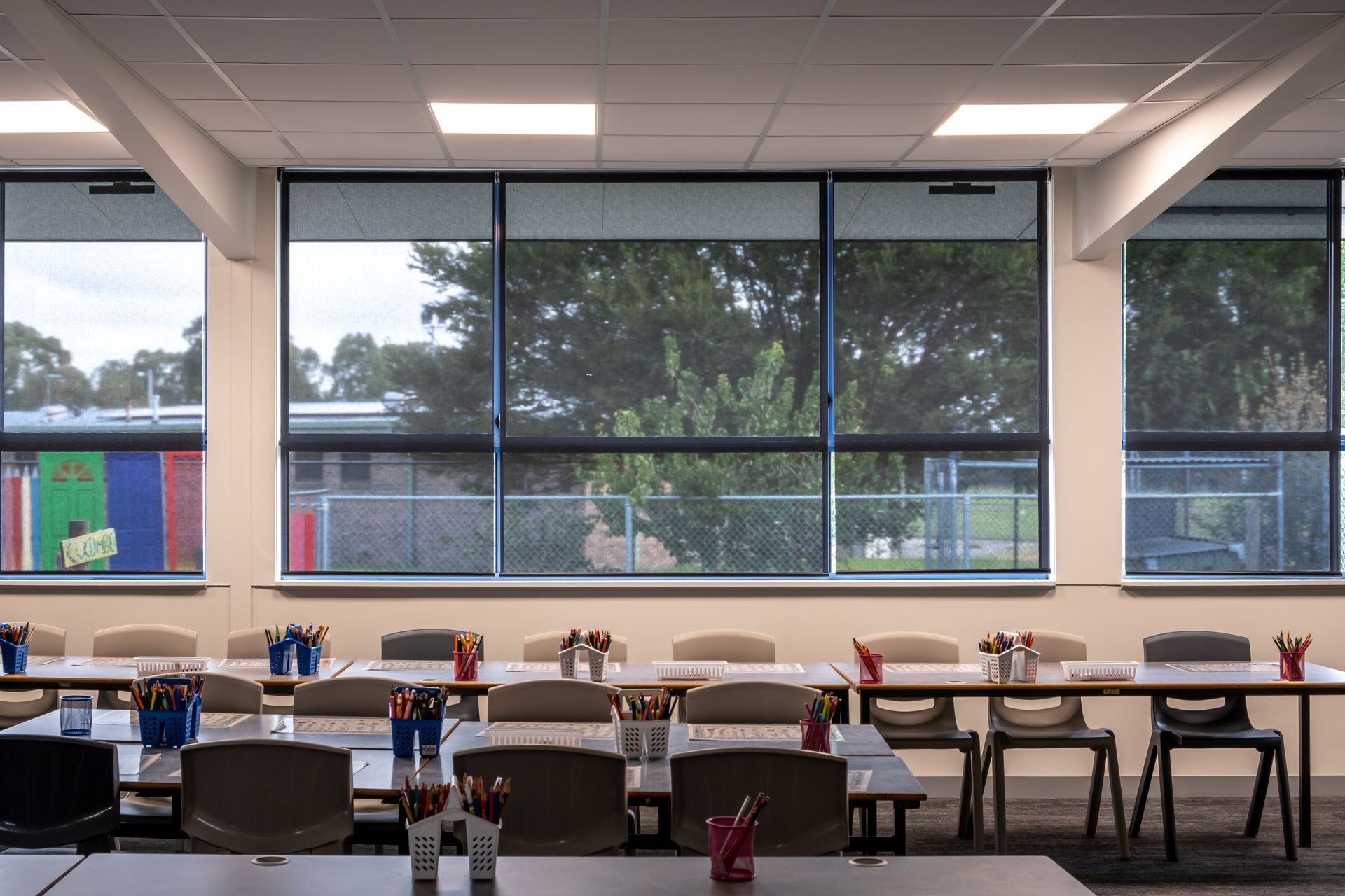Elementary school windows covered by roller shades near Manchester, New Hampshire (NH)