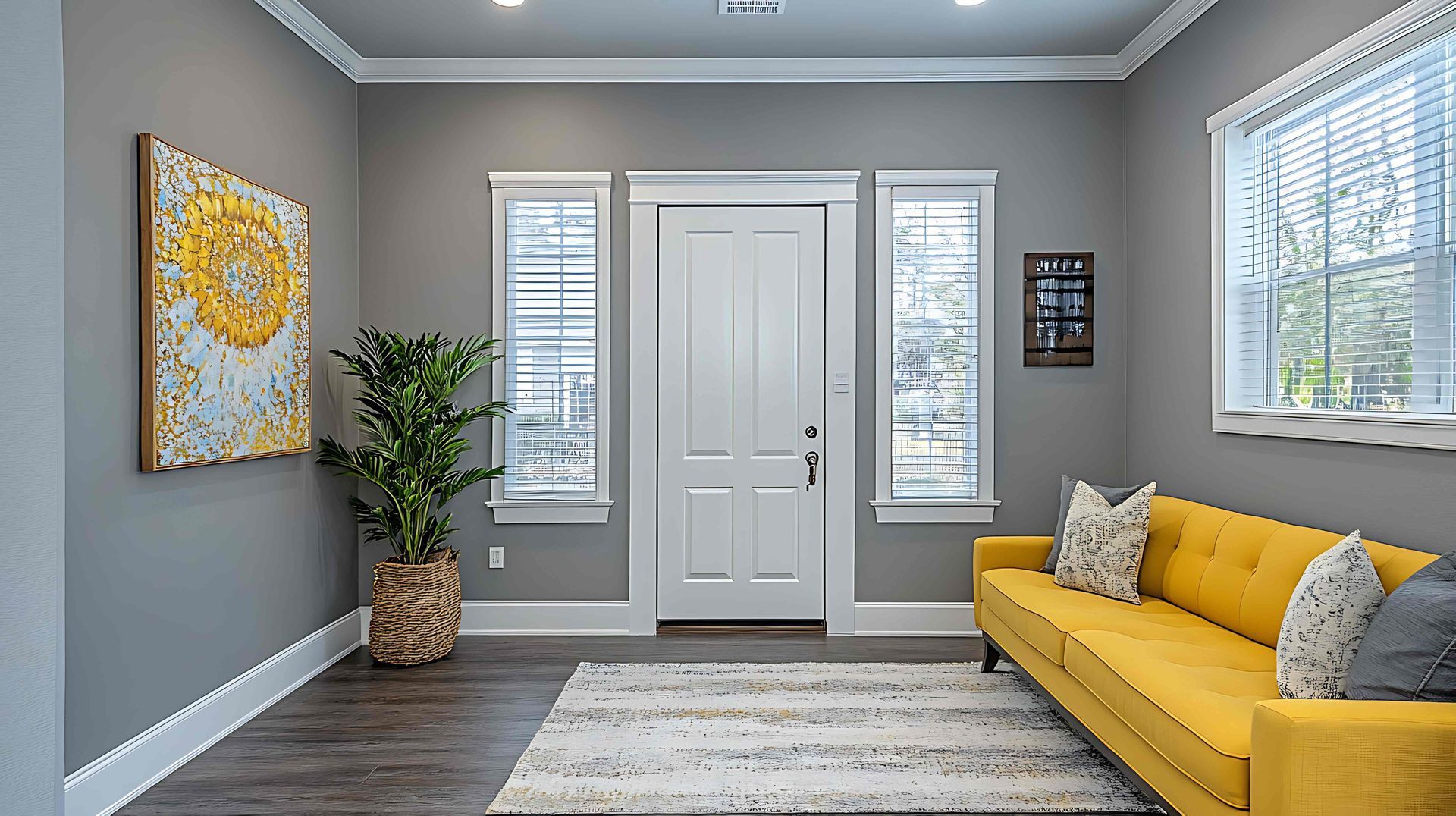 Modern entryway featuring white sidelight blinds and a yellow sofa at NH Blinds near  Manchester, NH.