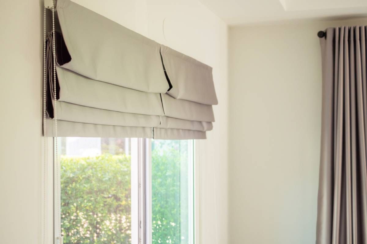 Custom Roman shades covering a sliding glass door near Manchester, NH