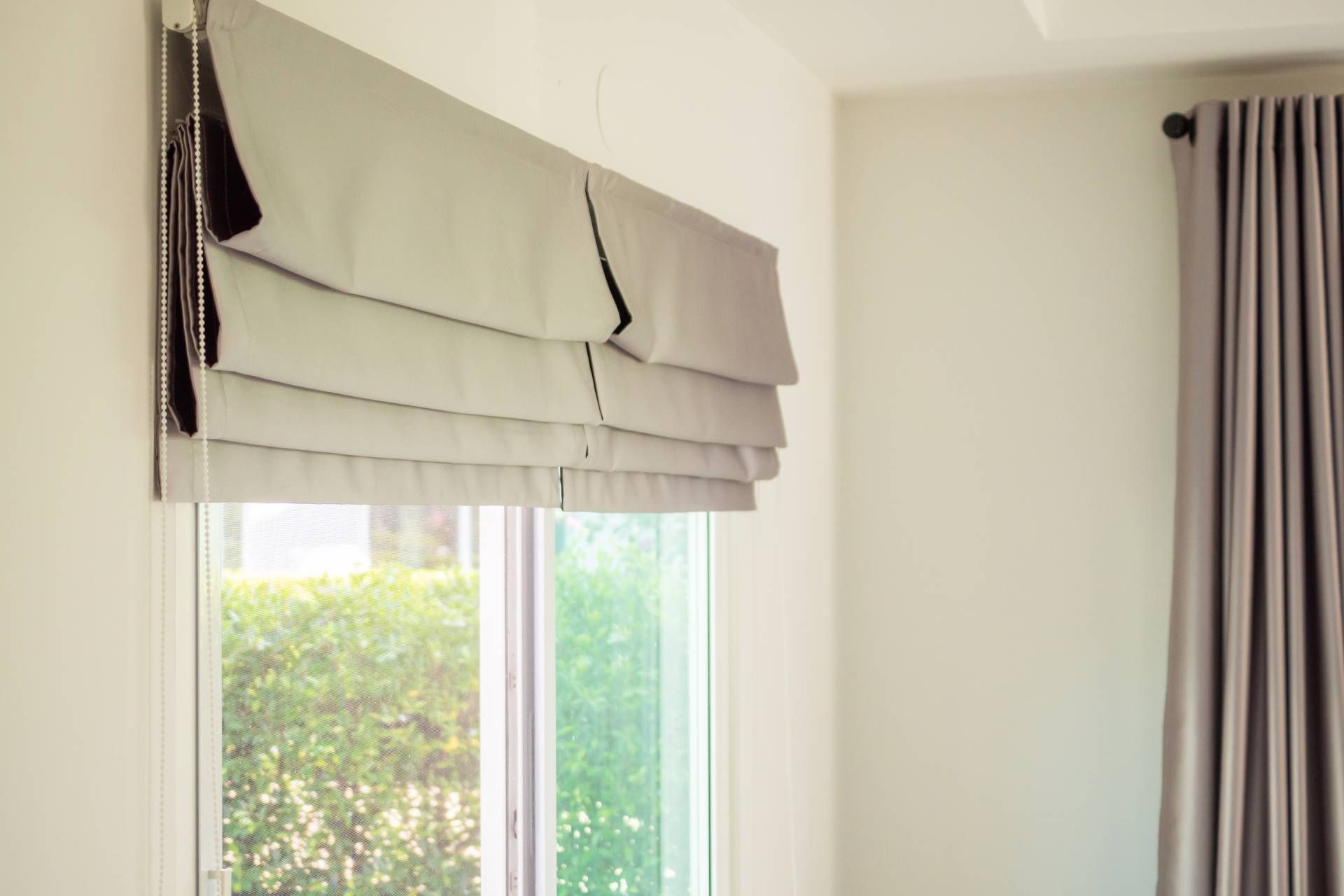 Custom Roman shades covering a sliding glass door near Manchester, NH