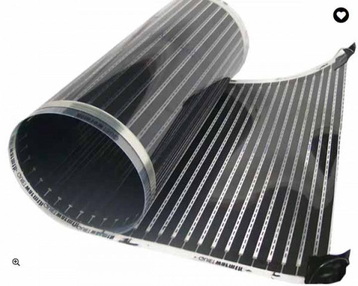 Rolled-up black and silver heating film, unrolled on a surface.