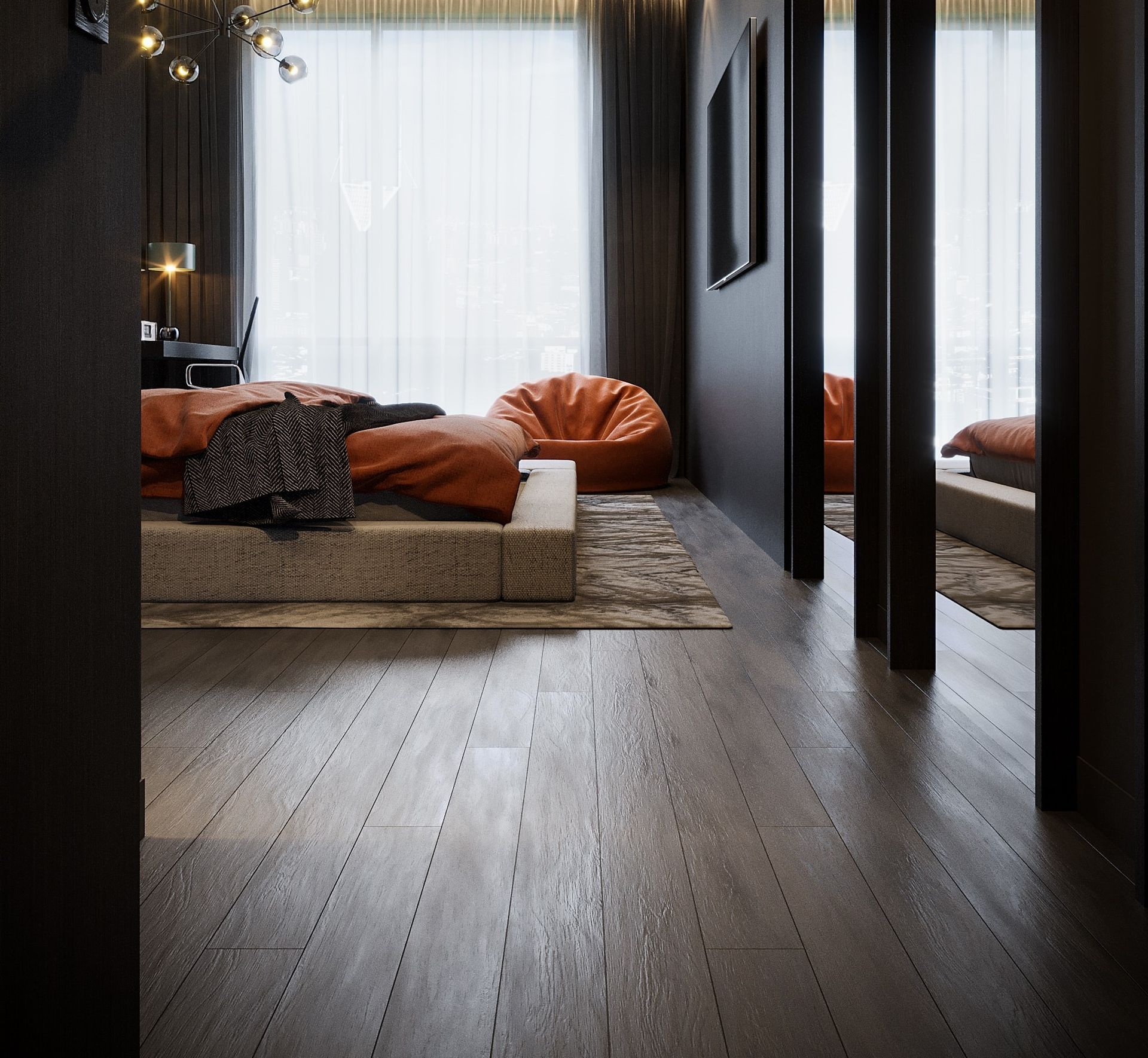Bedroom with wood floors, a large bed with orange bedding, and a beanbag chair.