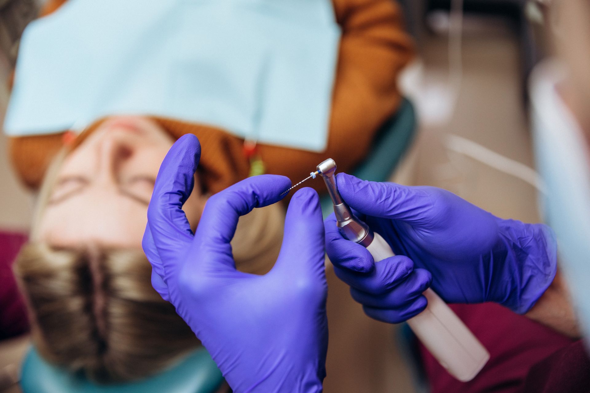 Closeup picture of dental instruments: Drill and needle for root canal treatment.