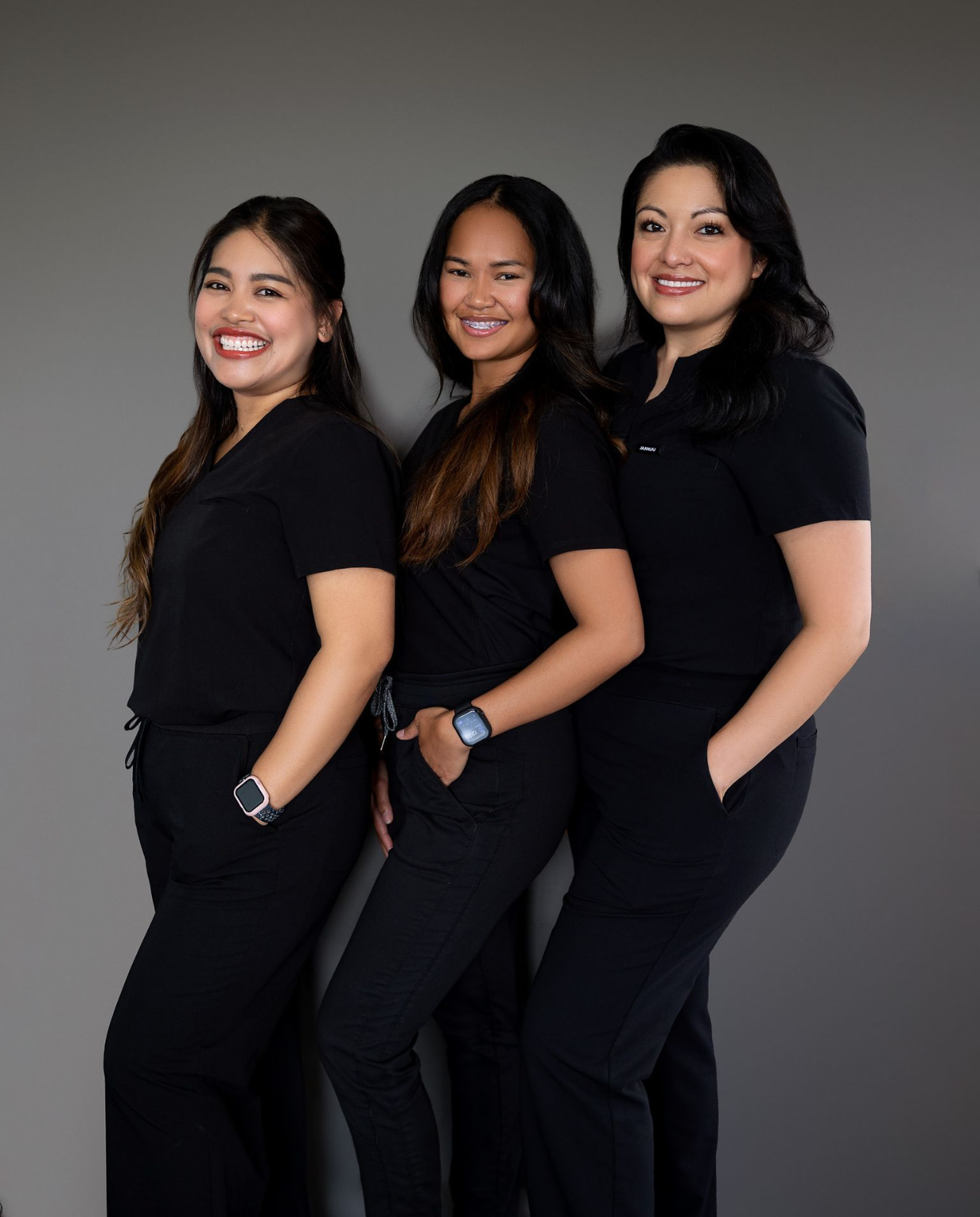 A nurse with a stethoscope around her neck is smiling with her arms crossed. — Kodiak, AK — BridgeView Dental