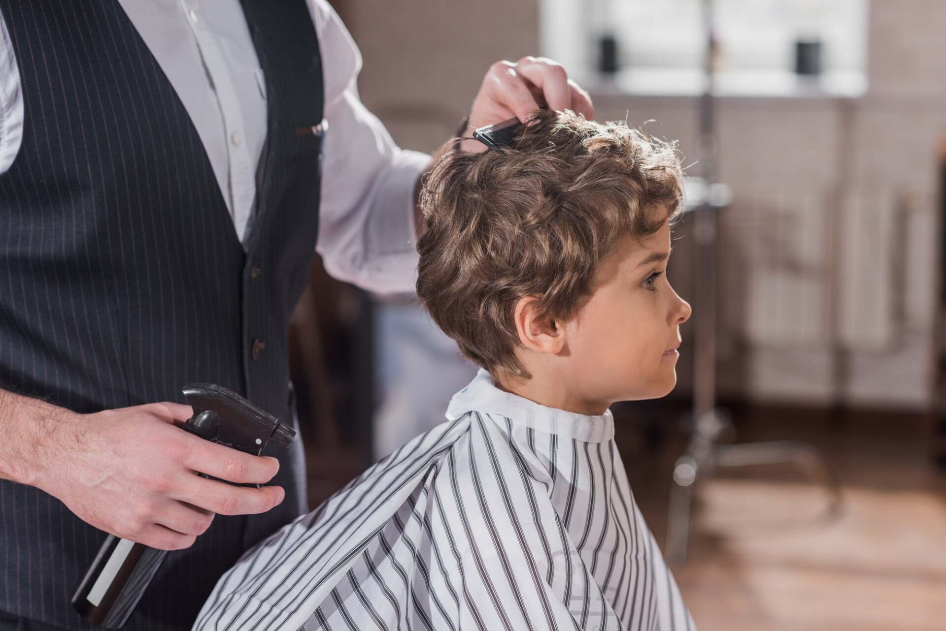A man doing haircut — Honolulu, HI — Hawaii-Kai Barber & Styling