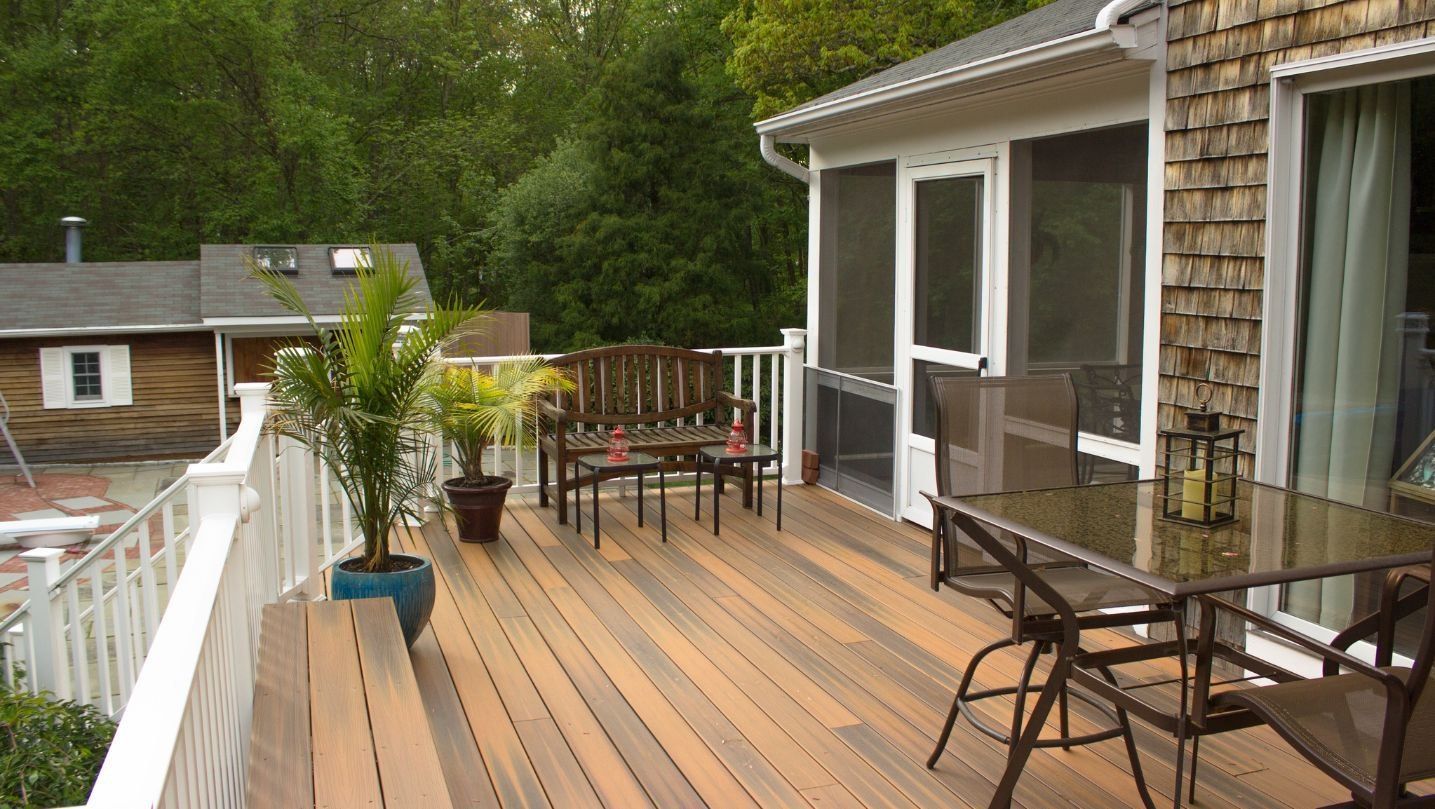 A deck with a table and chairs on it