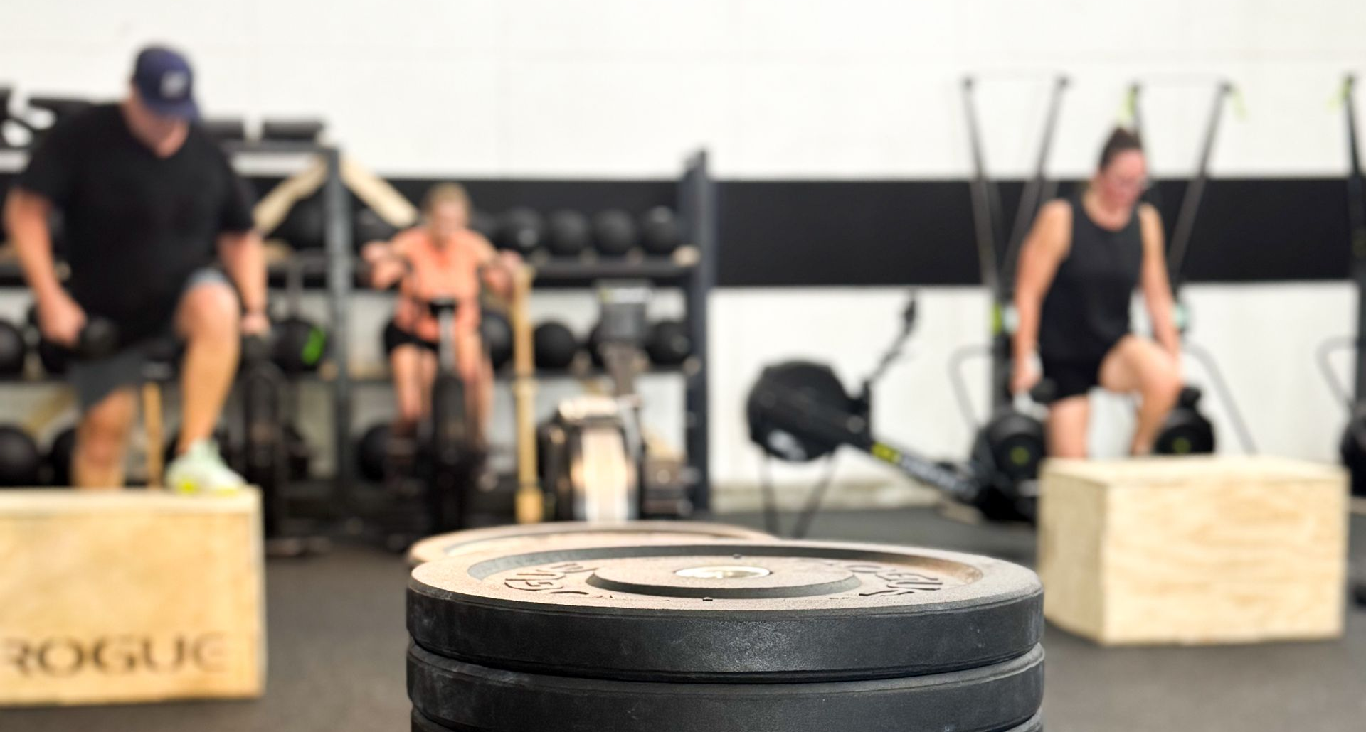 Members of all ages training together at an inclusive CrossFit gym in Orlando FL, building functional fitness and community.