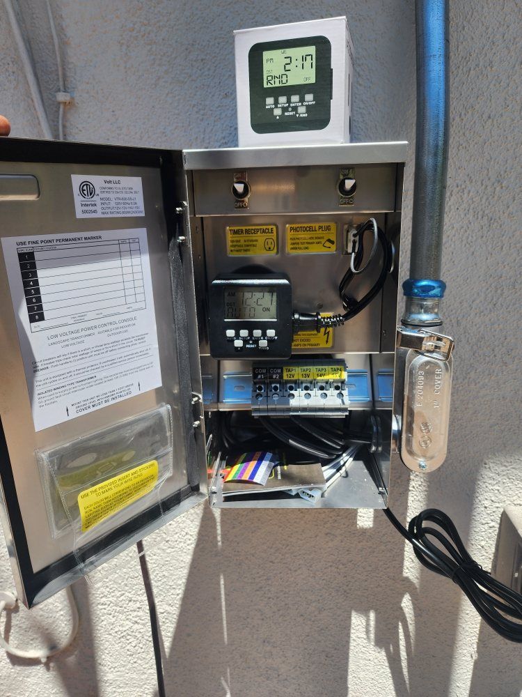 Open vending machine with a digital display and snack shelves, mounted on a wall outdoors.