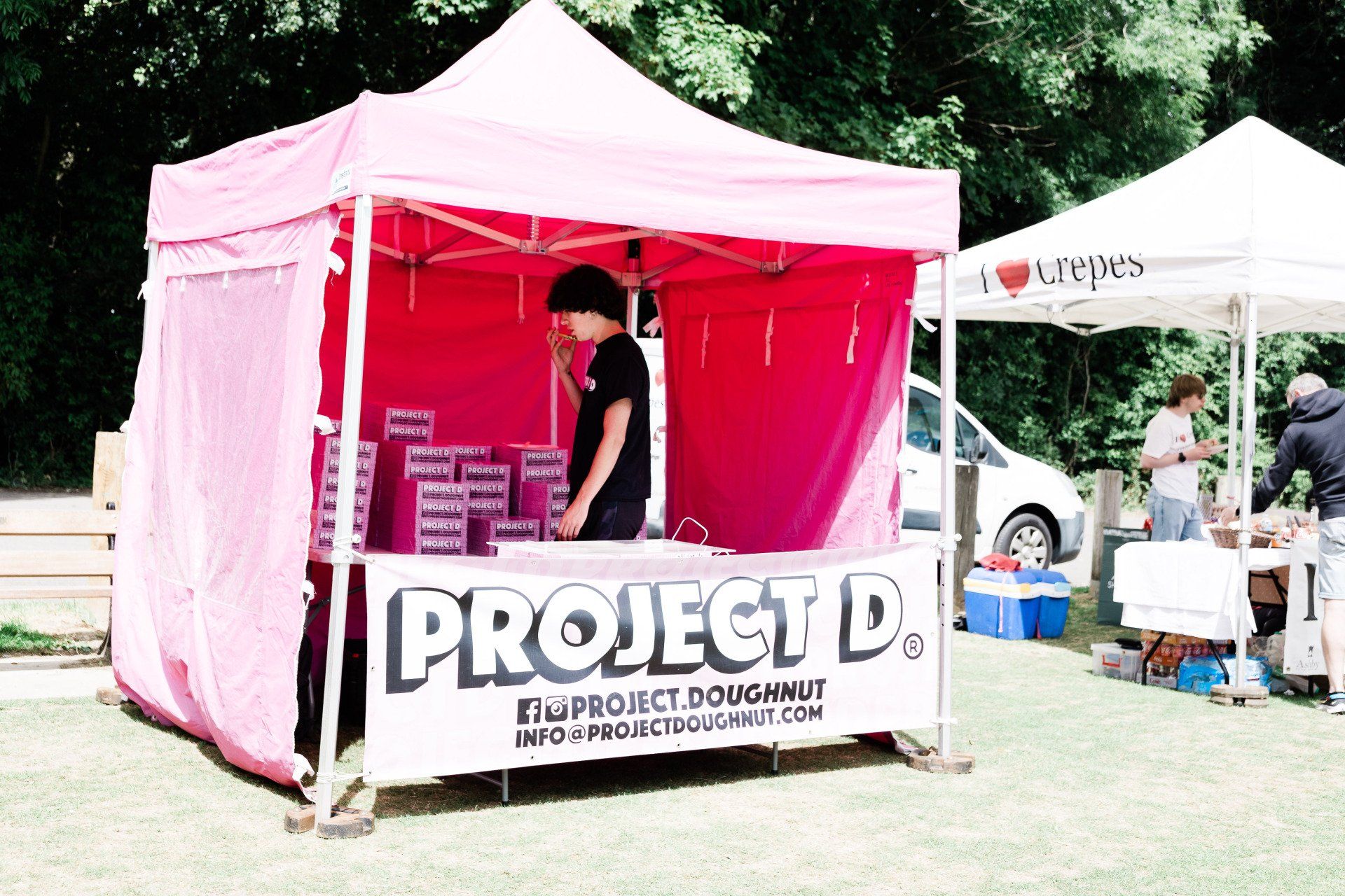 A pink tent with the word project on it