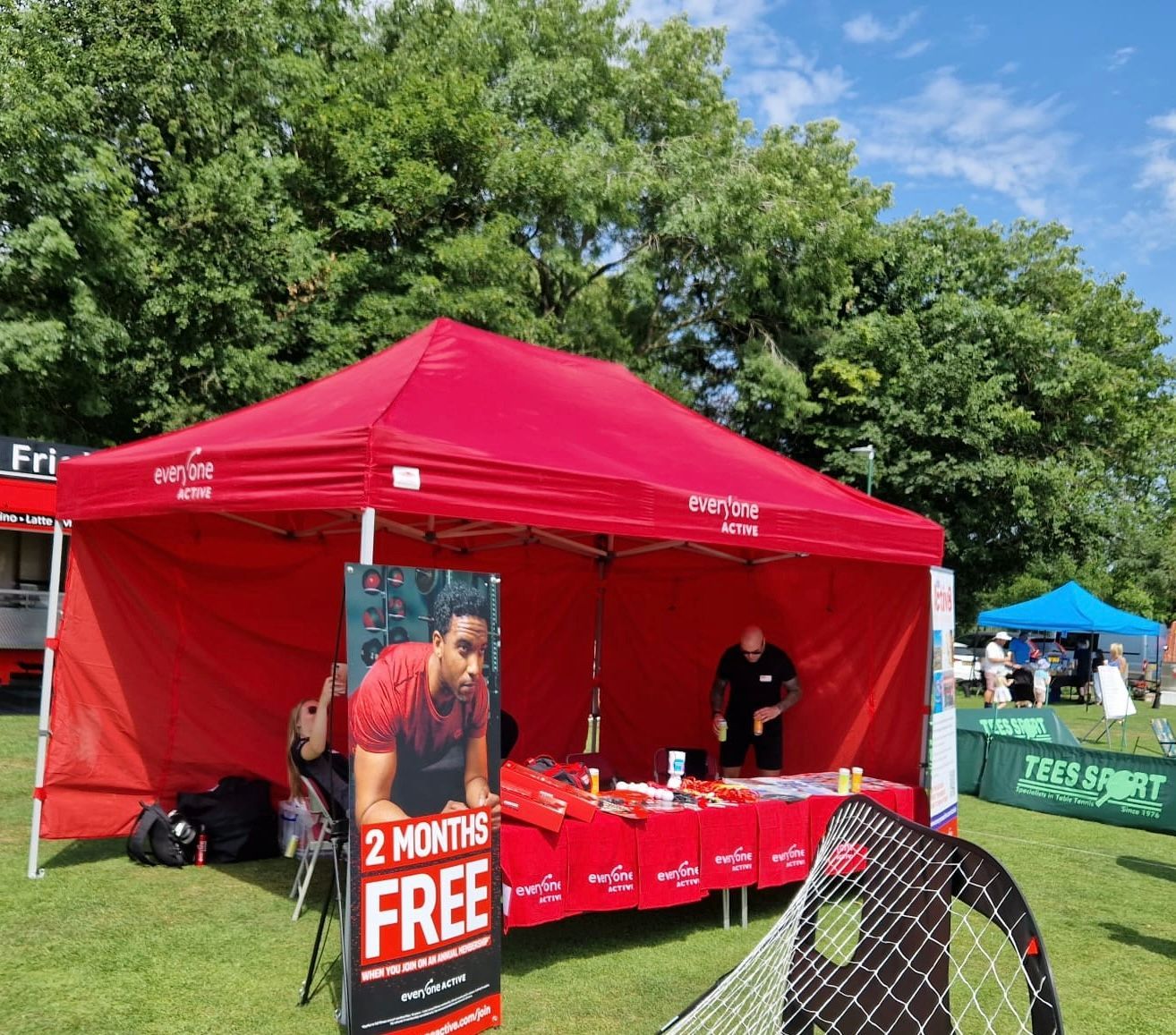 A red tent with a sign that says 2 months free