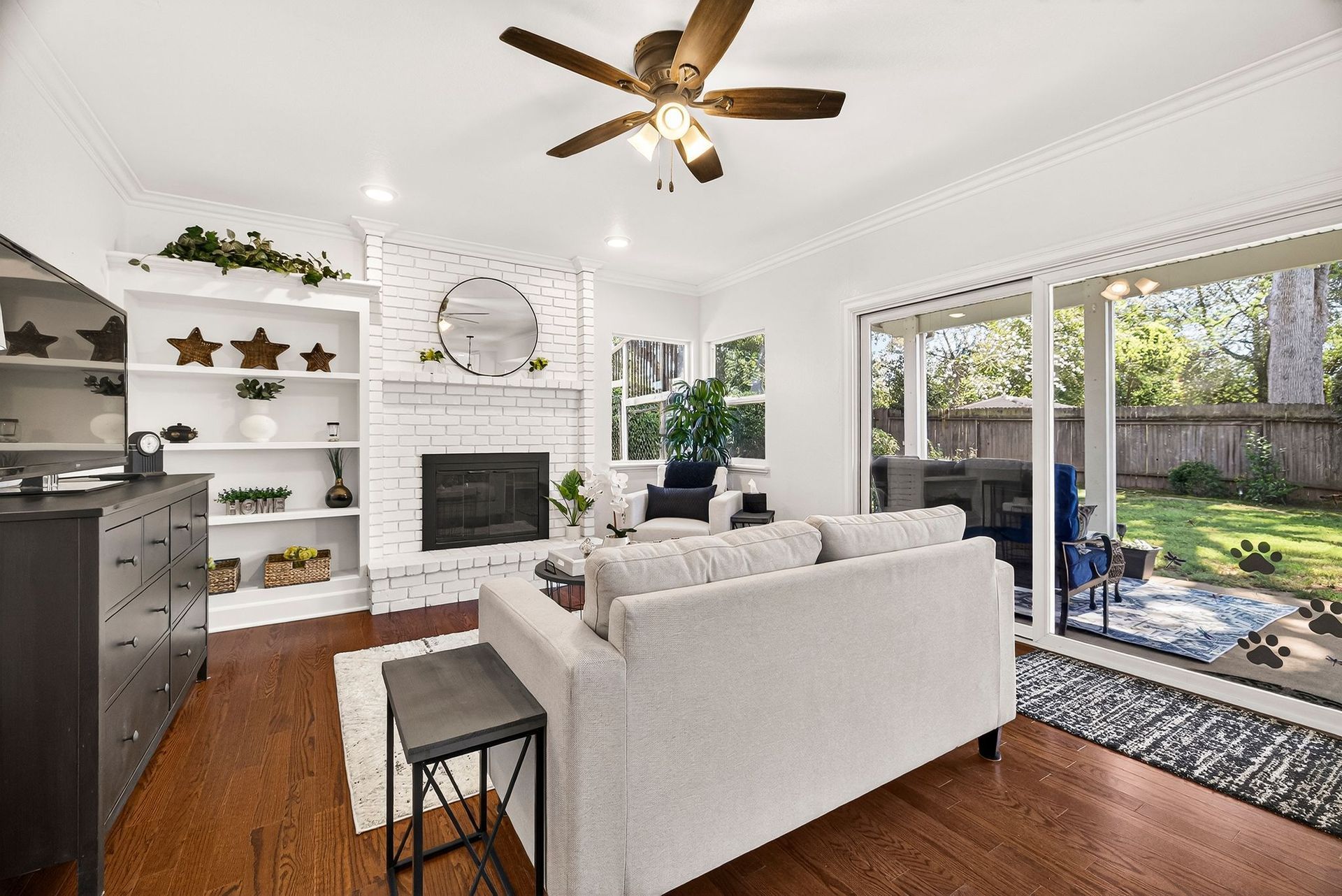 Bright living room with fireplace and large windows