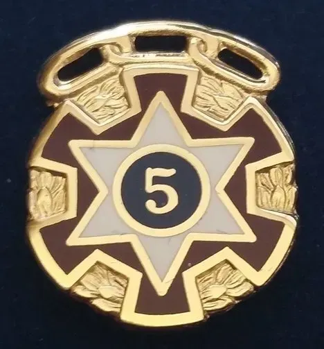 A badge with the number 5 on it