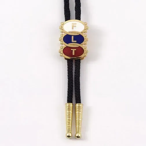 A bolo tie with the letters f l and t on it