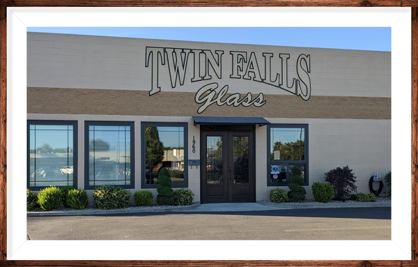 A picture of a building that says twin falls glass