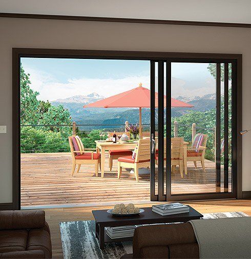A living room with a sliding glass door leading to a deck