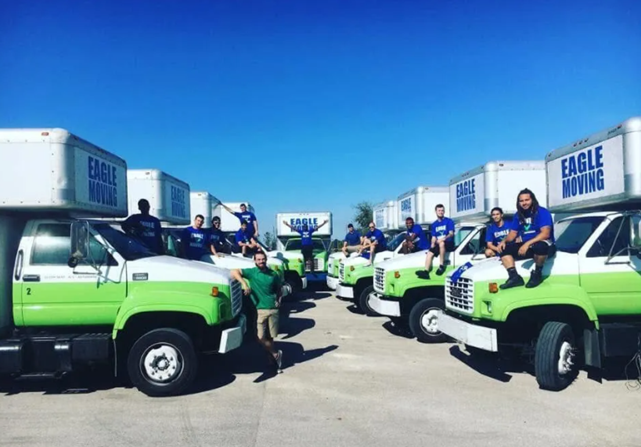 Team of professional movers with a large fleet of trucks for a local moving company.