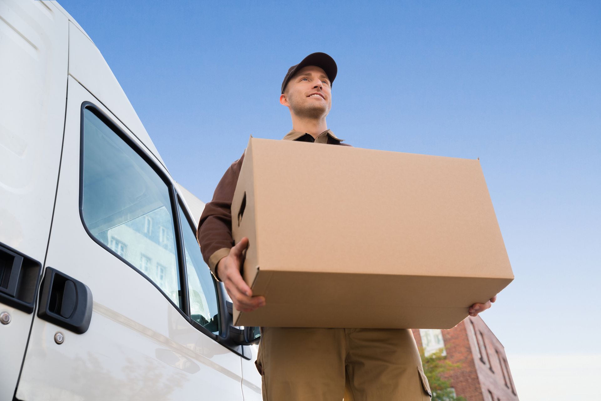 Team of movers unloading a van, highlighting reliable moving services for safe relocation.