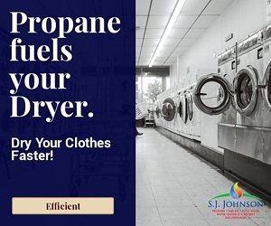 A laundromat with a sign that says propane fuels your dryer