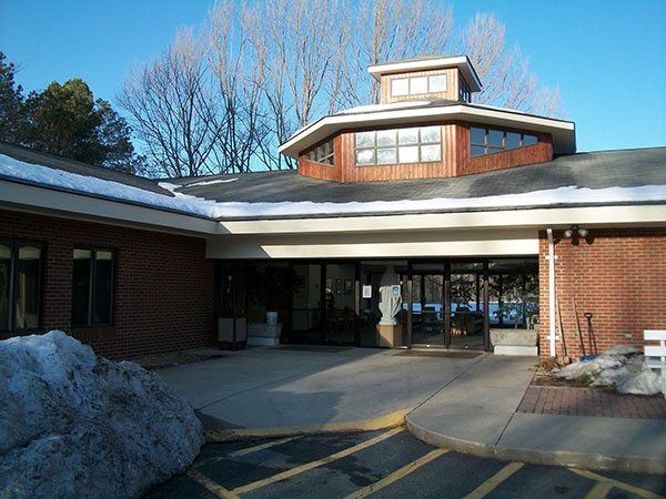 A large brick building with a round roof