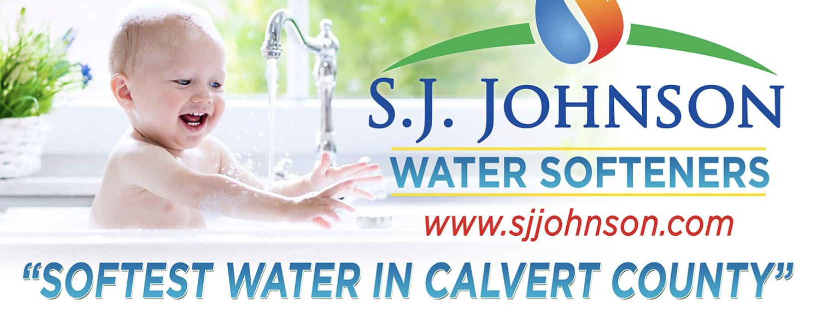 A baby is sitting in a bathtub with a s.j. johnson water softeners logo
