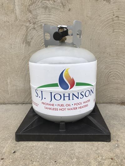 A propane tank with the name s.j. johnson on it