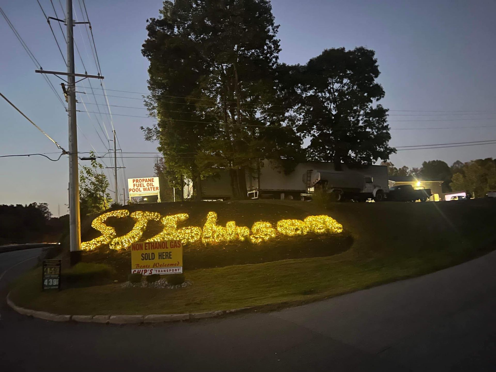 A sign that says johnson is lit up at night