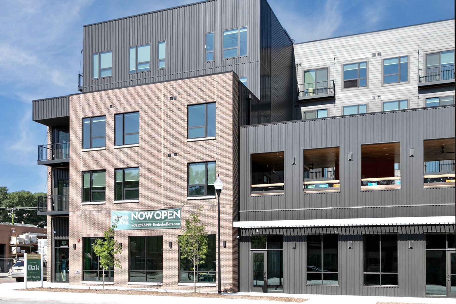 Modern apartment building with storefronts and a