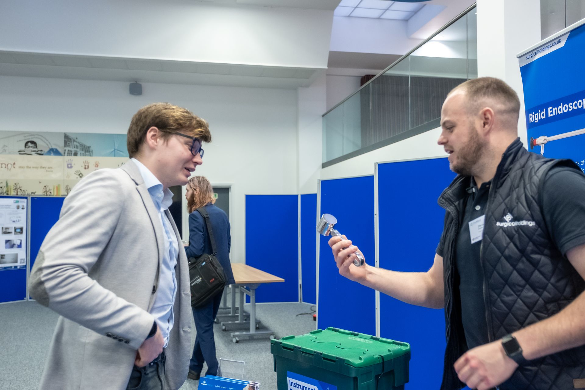 Photo Conference delegate engaging with an exhibitor