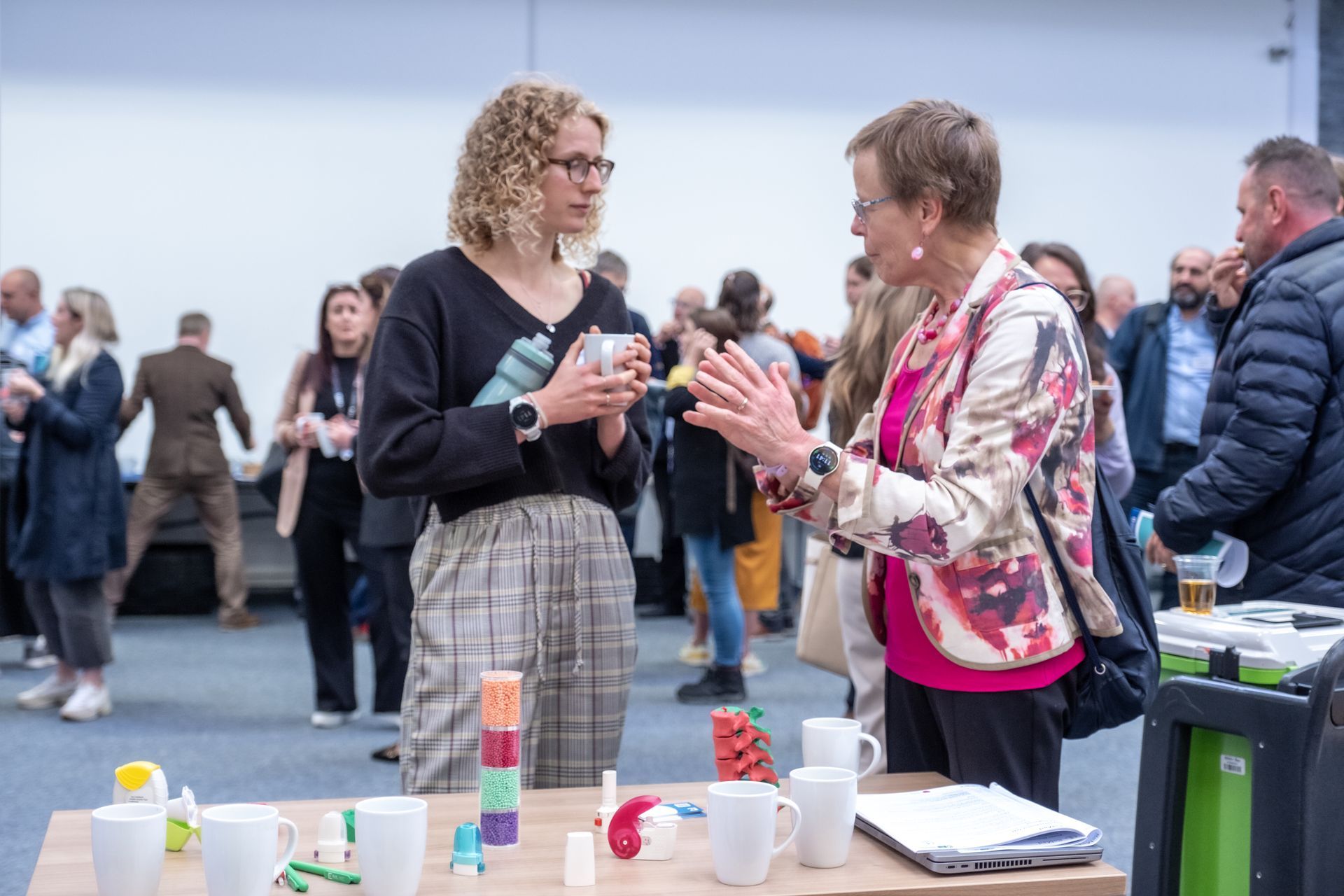 Photo of ReMed researchers and delegates engaging during the poster session