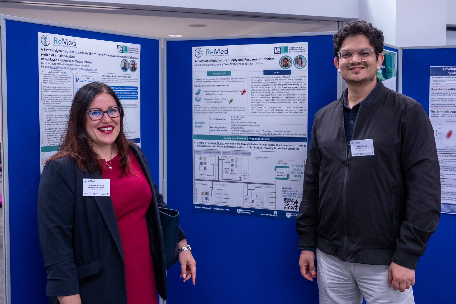 Photo of ReMed researchers and delegates engaging during the poster session