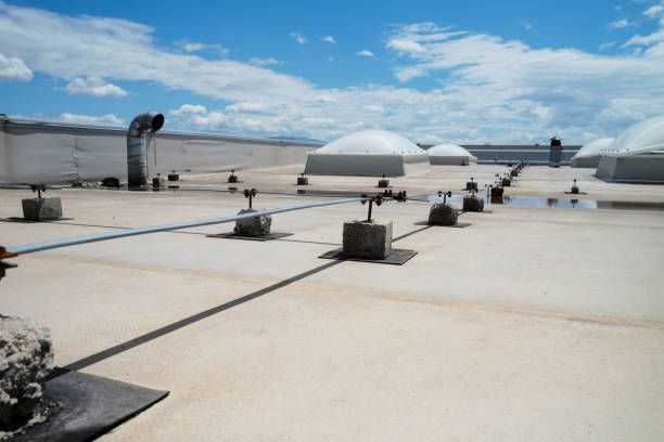 A roof with a lot of lights on it and a blue sky in the background.