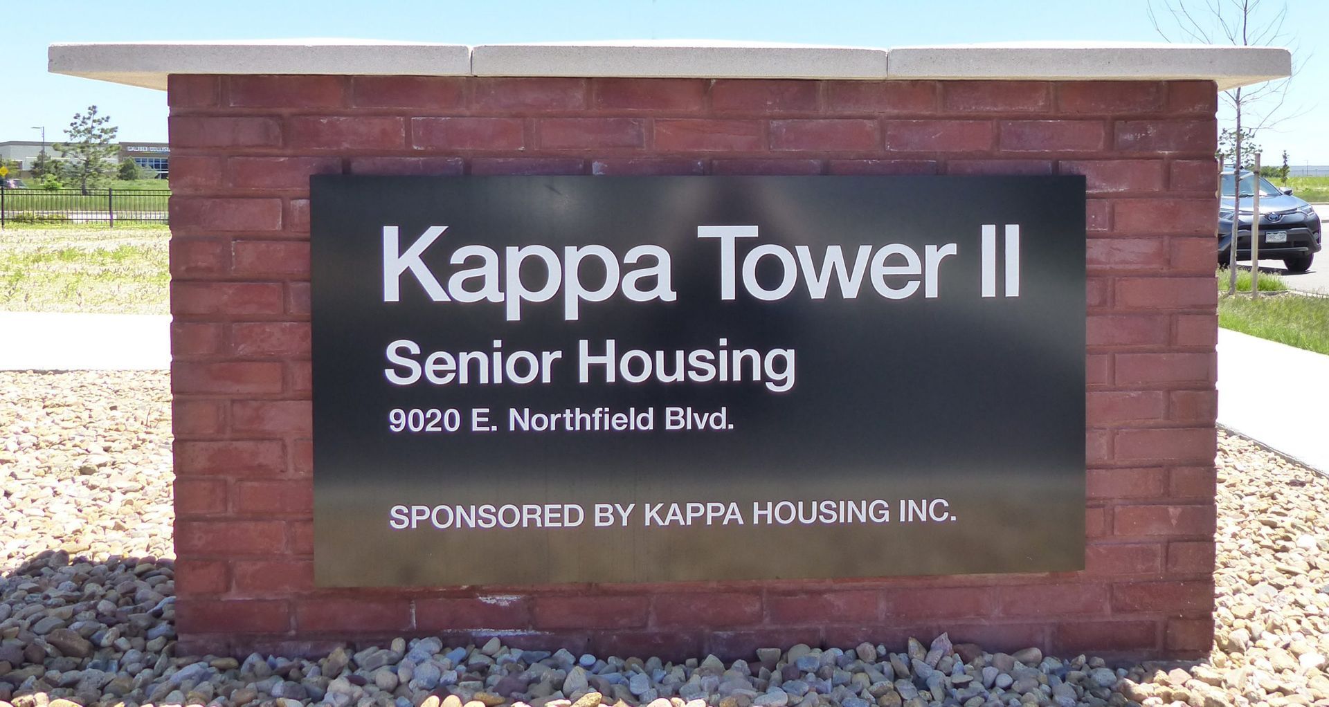 Kappa Tower II Senior Housing sign on a brick monument at 9020 E. Northfield Blvd.