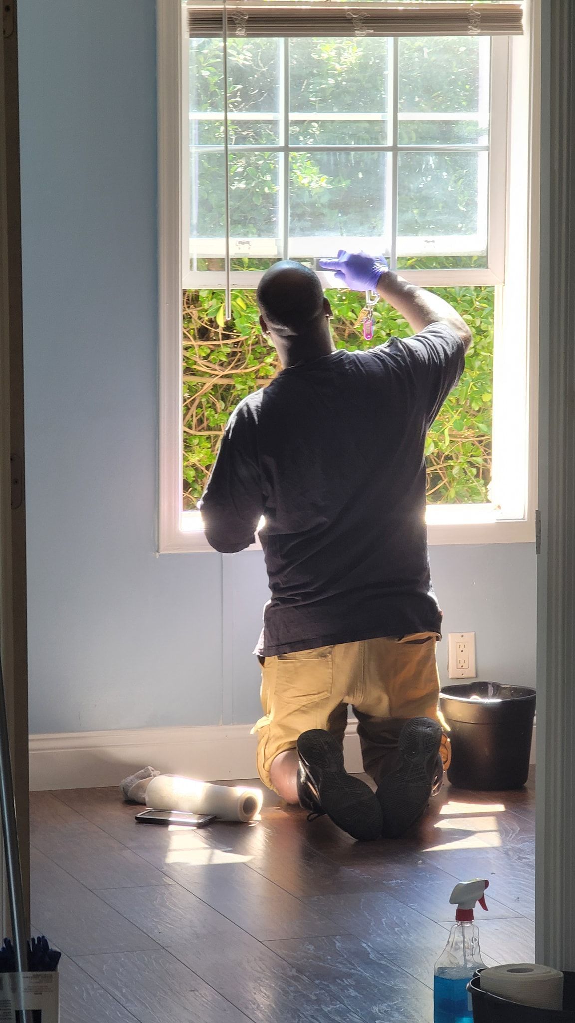 one of DAG personnel cleaning the window