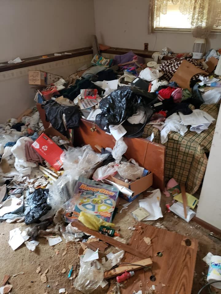 a messy and full of garbage living room