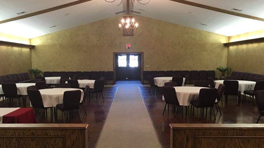 a large room with tables and chairs in it
