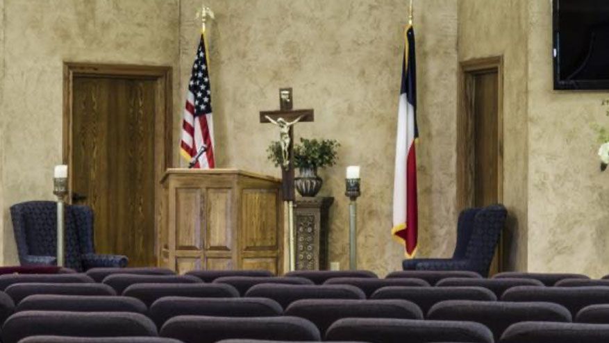 there is a cross in the middle of the church .