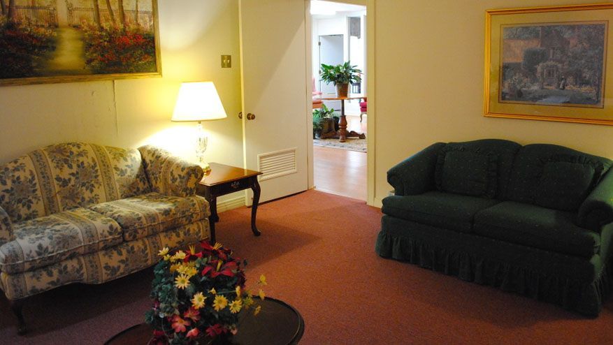 a living room with two couches and a table