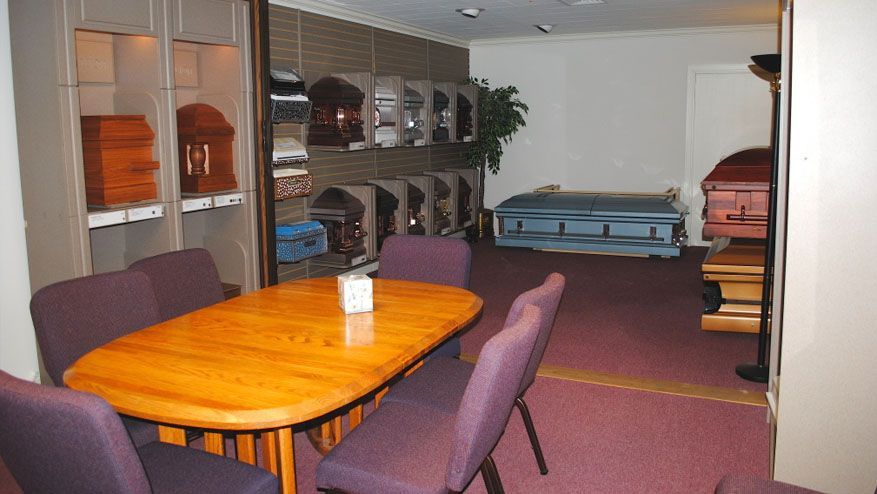 a room with a table and chairs in it