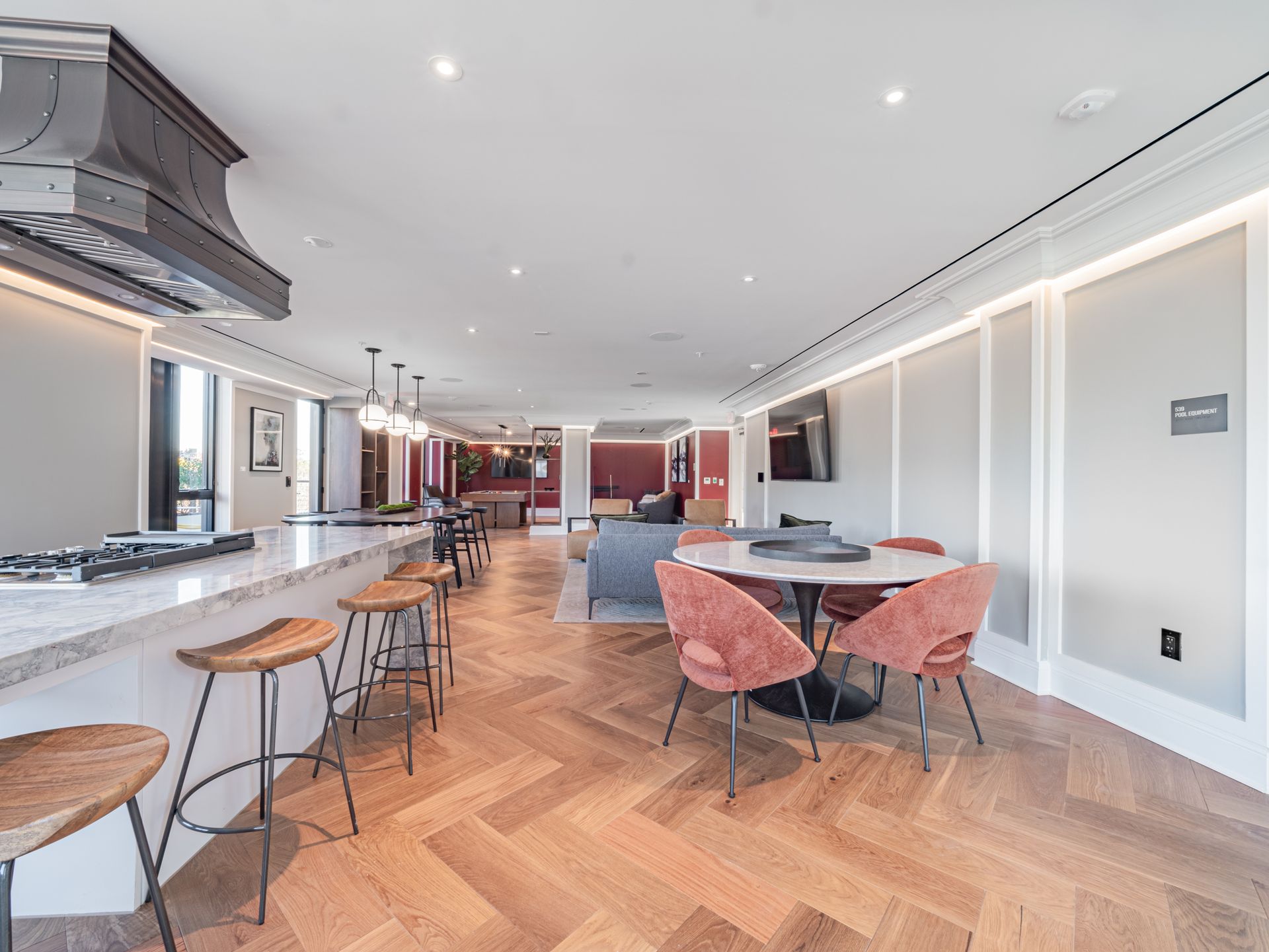 A woman is laying in bed reading a book