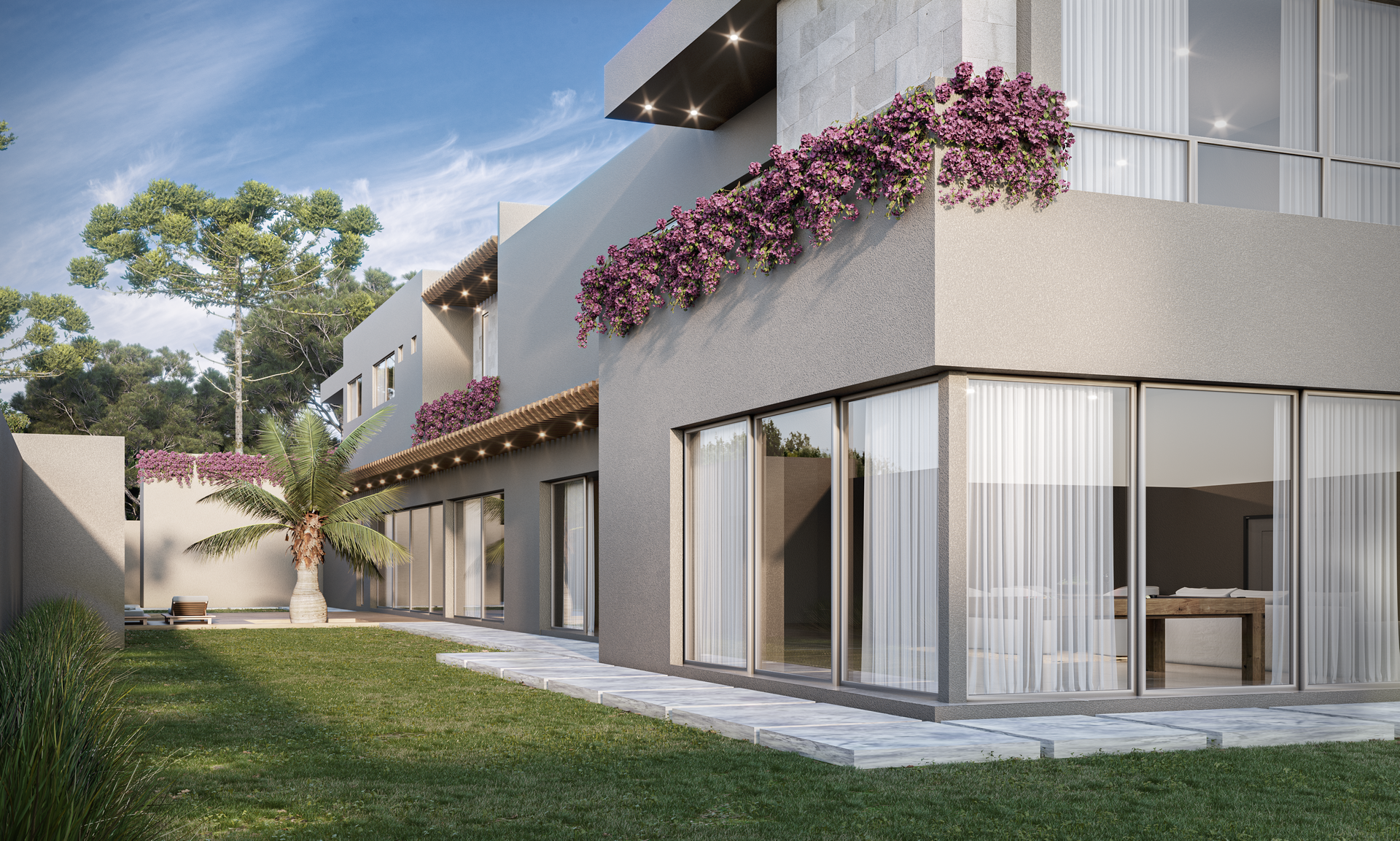 Patio Guadalquivir con puertas corredizas de vidrio, balcones en la planta superior y enredaderas de flores moradas.
