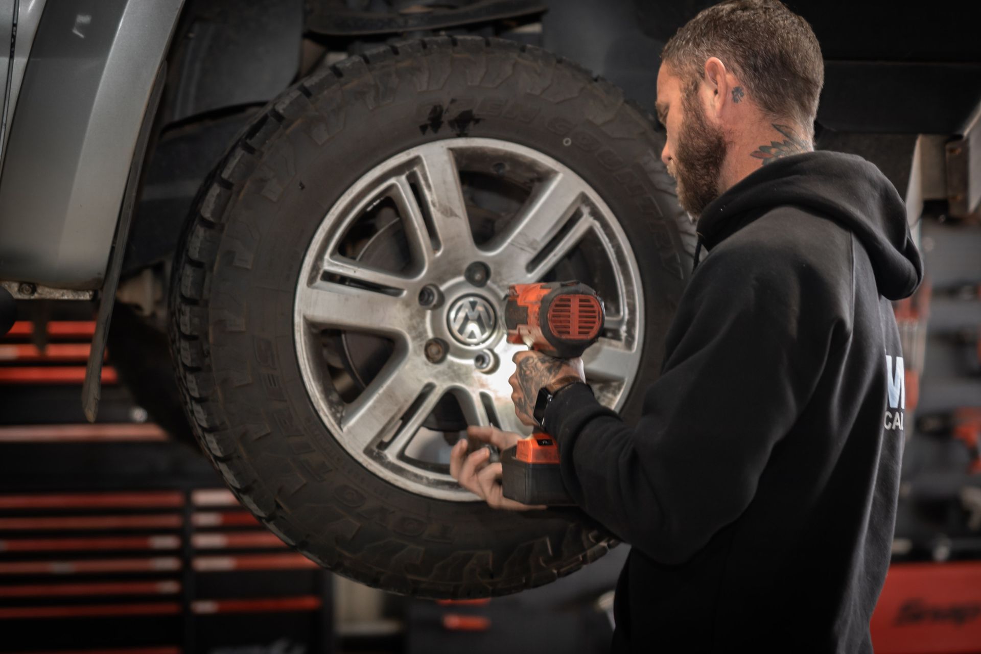 Bolting a wheel after replacing it.