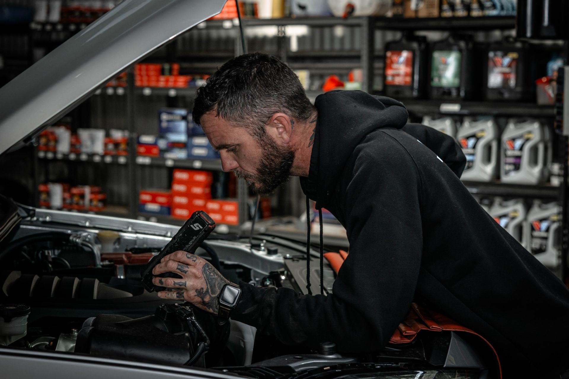 mechanic inspecting a car engine
