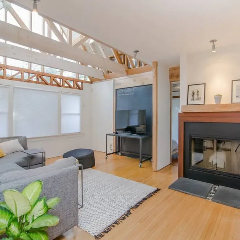 A living room with a fireplace and a couch
