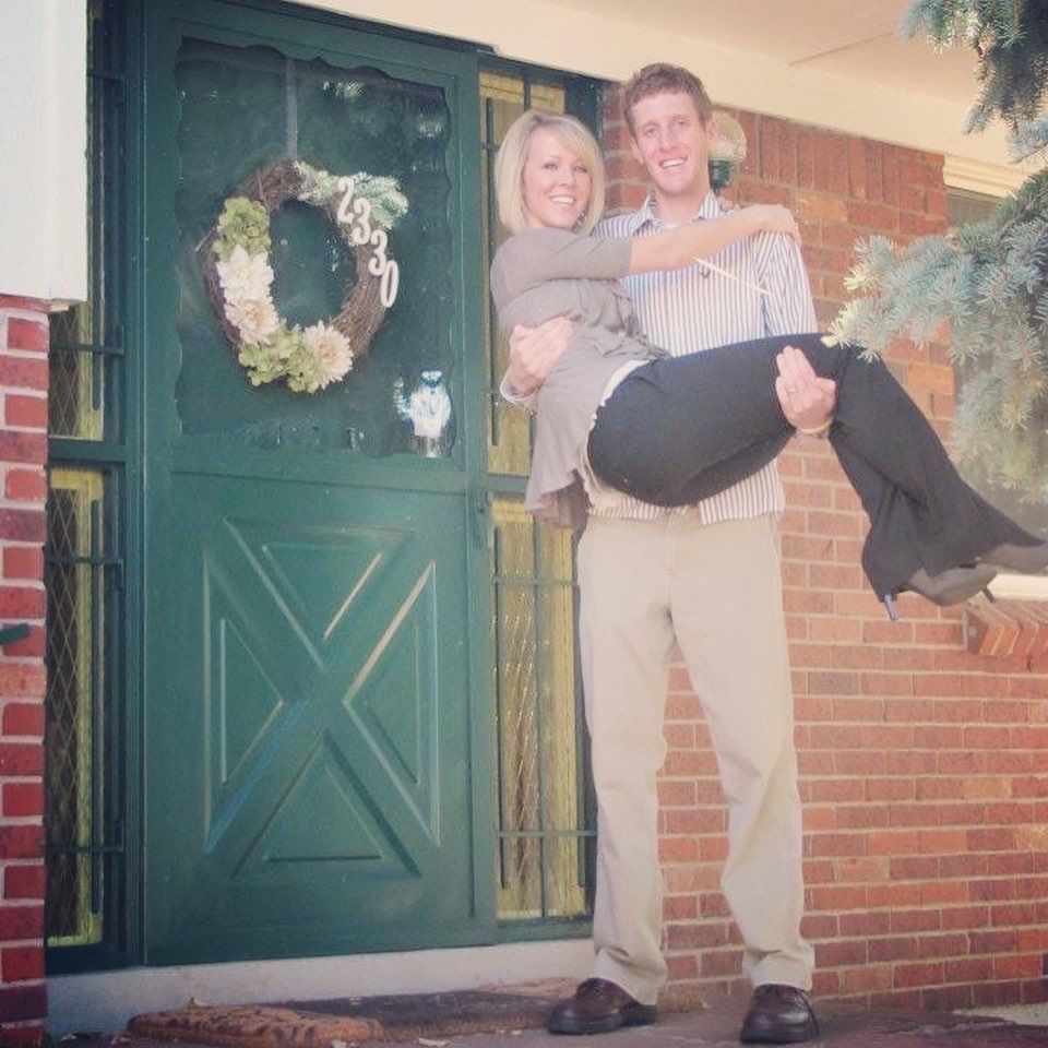 First Time Homeowners in front of First Home