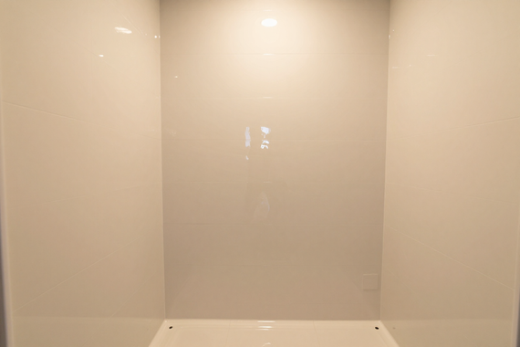 Sealed epoxy shower interior with seamless waterproof coating