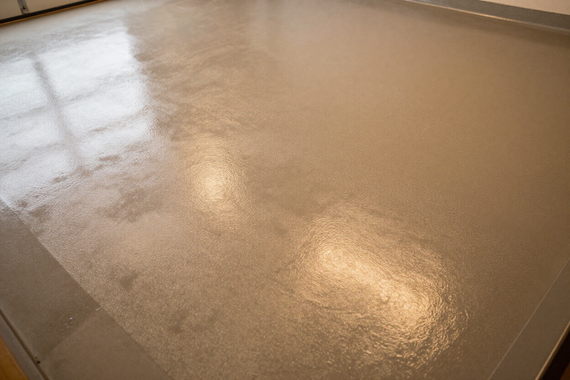 Epoxy garage floor with high-gloss metallic shimmer