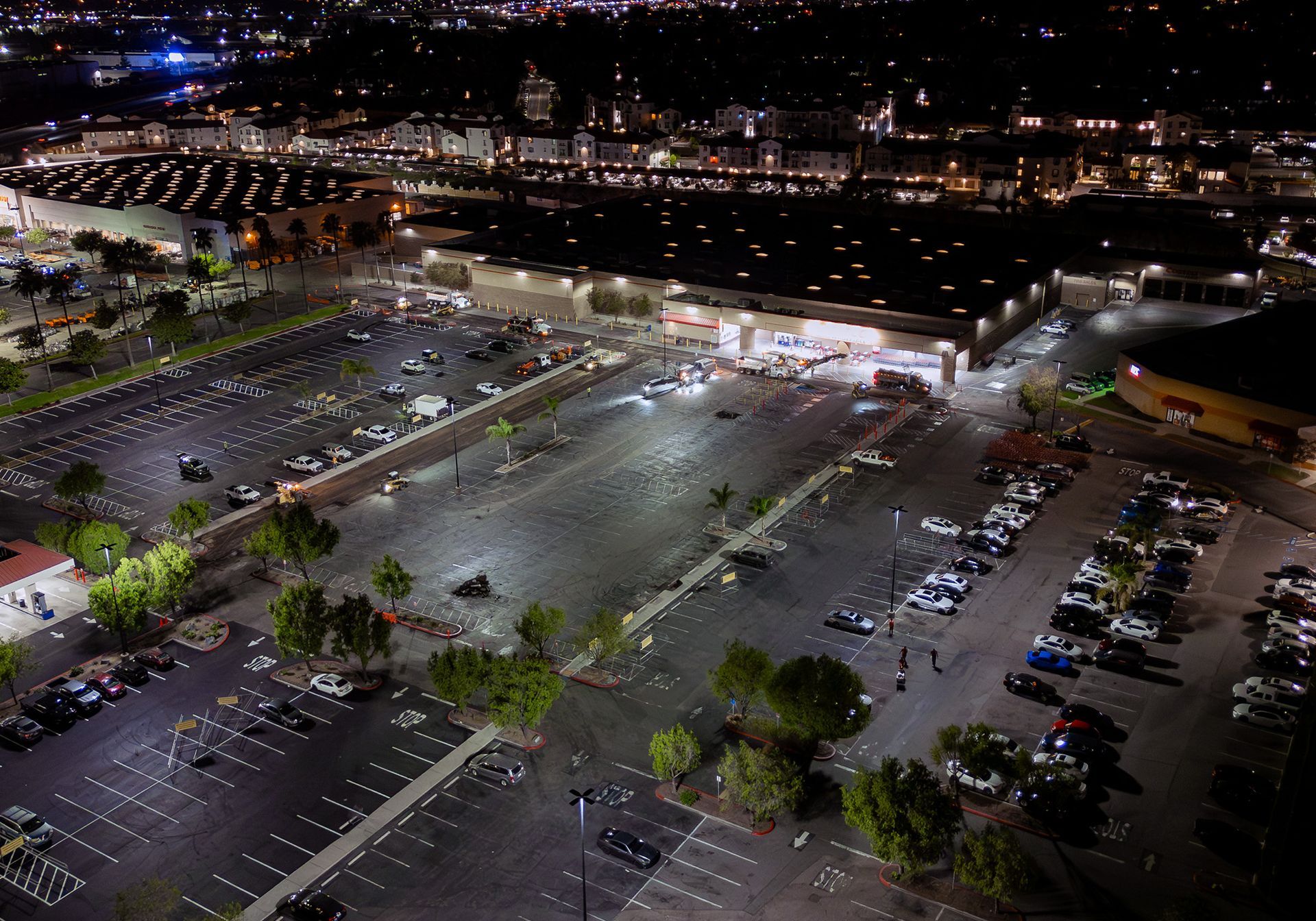 An aerial view of a parking lot at night