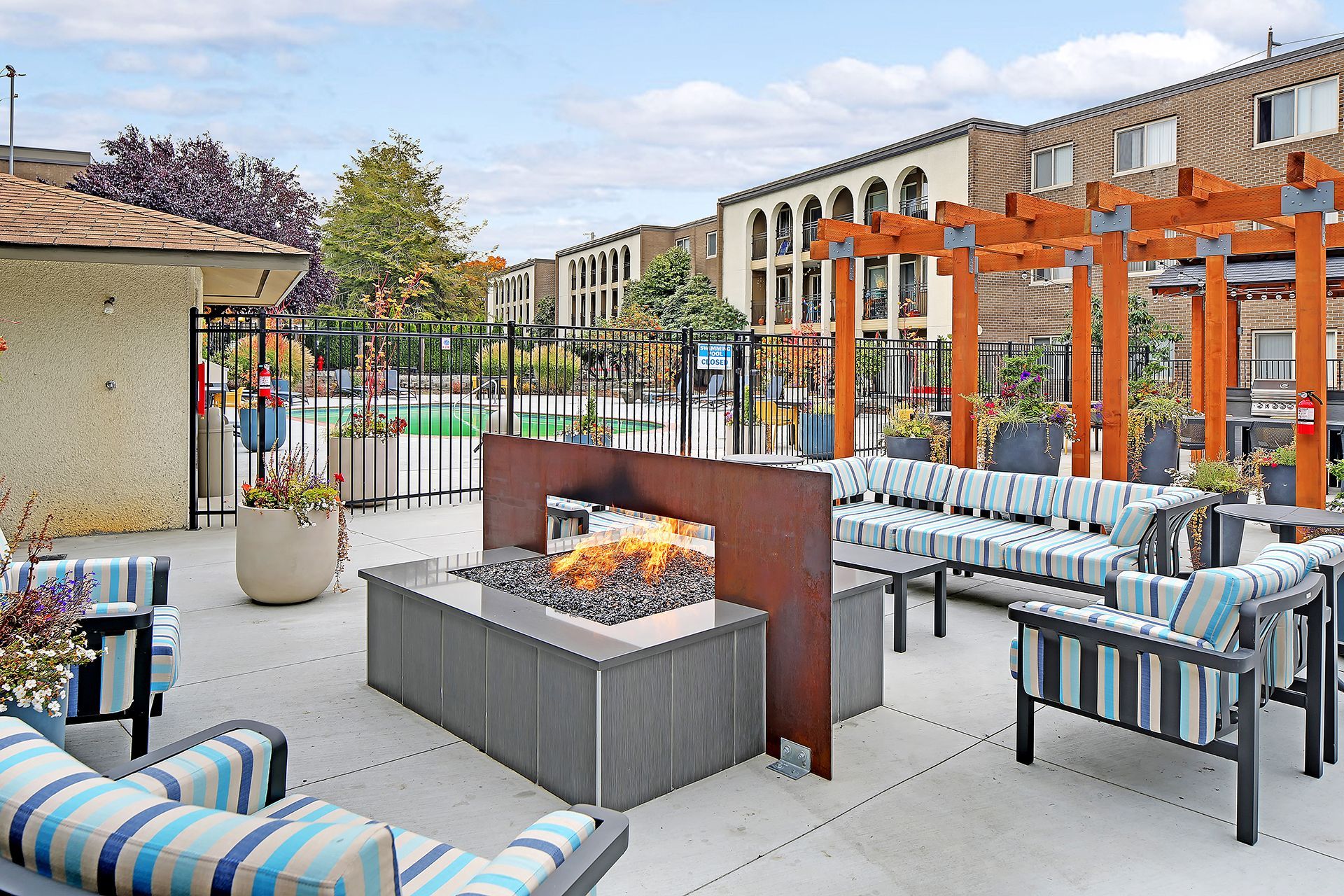 There is a fire pit in the middle of the patio area.