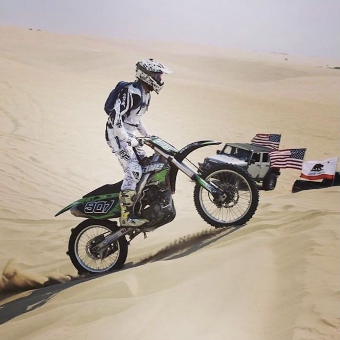 A man on a dirt bike with the number 509 on the back